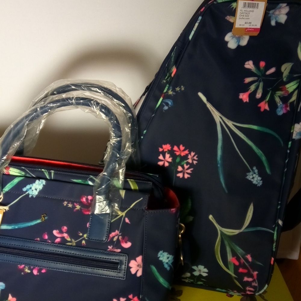 A medium sized crossbody bag/ large carry-o